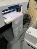 22 inch DTF gang sheet coming off the printer